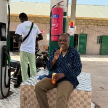 wayne at a gas station in The Gambia